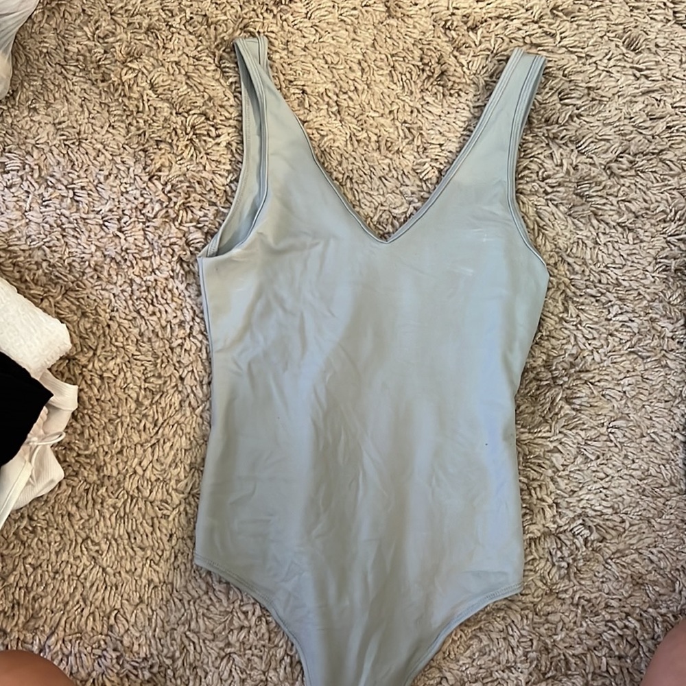 Light blue/ grey Abercrombie body suit.